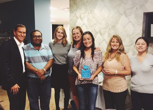 A few members of the NextGen project team celebrate the Partner Innovation Award during our team kickoff on Monday night