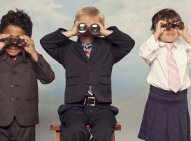 Business Children Looking For Profits Through Binoculars