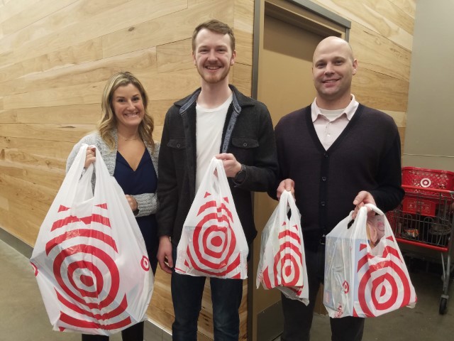 Pictures of Perficient employees at with Target bags