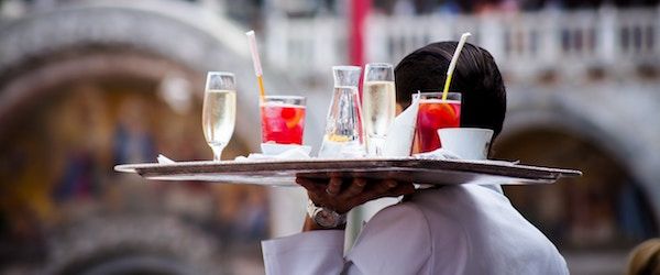 A waiter bringing drinks