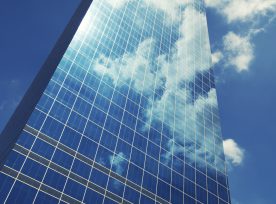 Sleek Glass Office Skyscraper Blue Sky Business Reflection