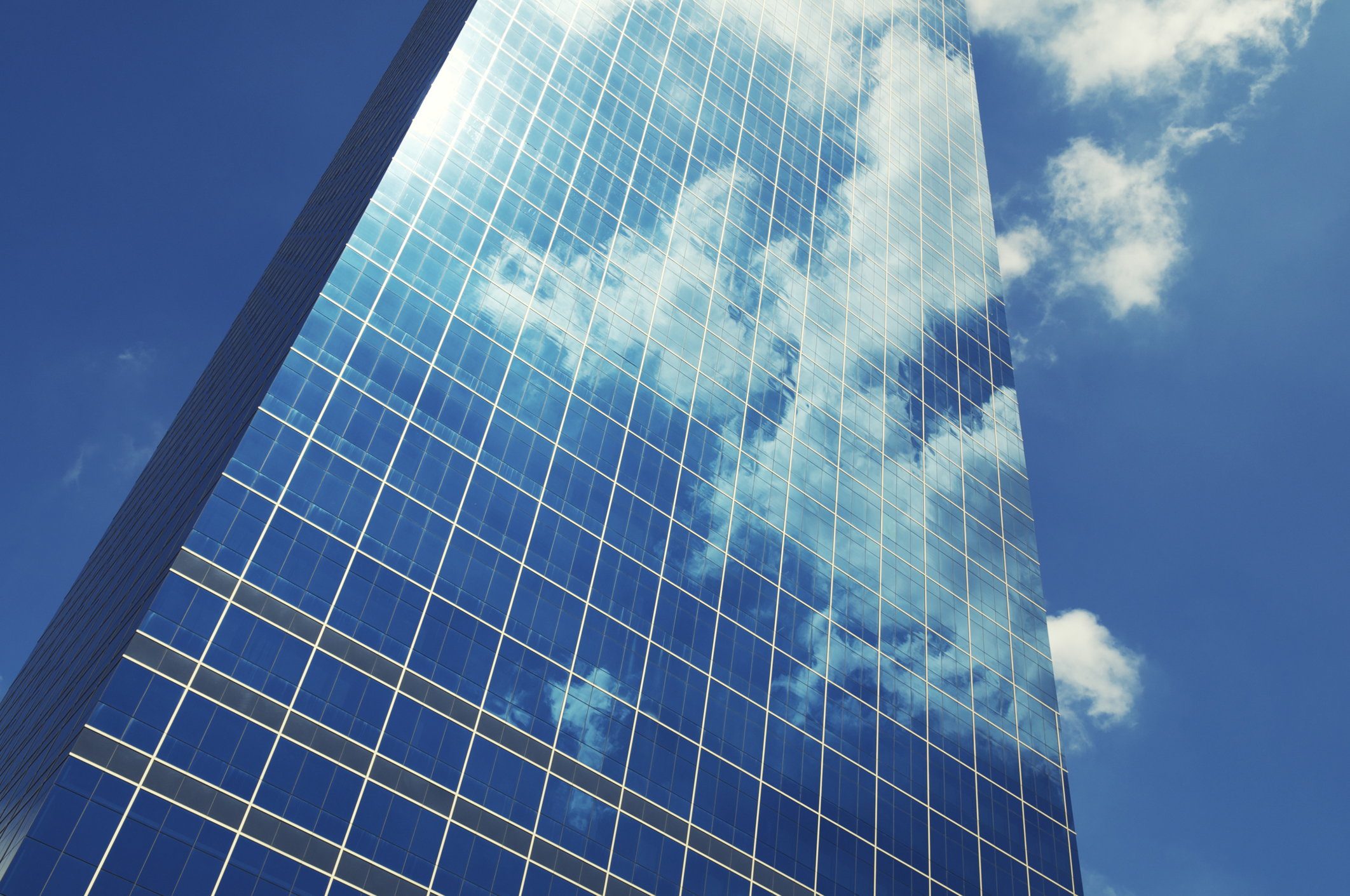 Sleek Glass Office Skyscraper Blue Sky Business Reflection