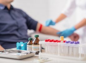 Man Getting Blood Test Preparation In Clinic