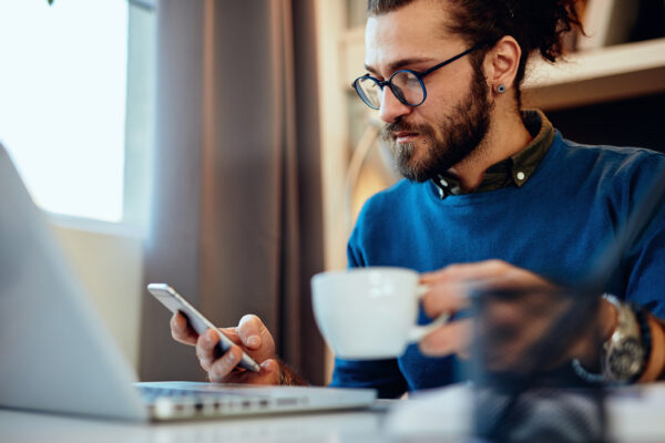 Blogging Man Table Cellphone