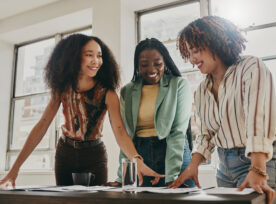 Teamwork, Collaboration And Planning Black Women With Documents, Paperwork Or Design Strategy In Office. Business Startup, Gender Equality And Marketing Ideas Of Diversity People In Workspace Meeting