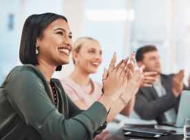 Shot Of A Group Of Businesspeople Clapping During A Meeting In A Modern Office