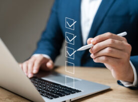 Business Performance Checklist Concept, Businessman Using Laptop Doing Online Checklist Survey, Filling Out Digital Form Checklist.