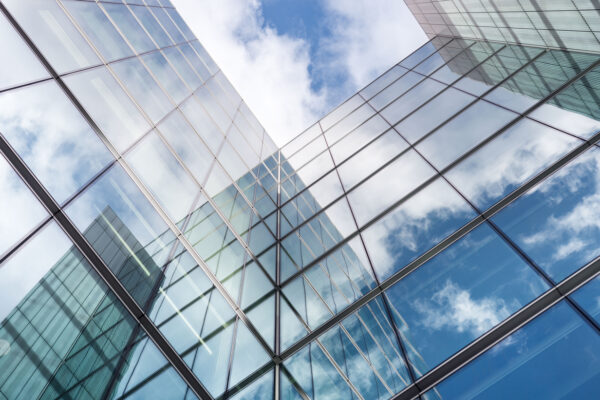 Looking Up A Reflections On Glass Covered Corporate Building