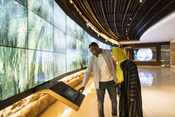 Tourists Using Technology In At Turaif Visitor’s Centre