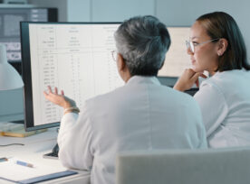 Science, Hospital And Women On Computer For Research, Medical Report And Data Analytics In Laboratory. Healthcare, Teamwork And Female Scientist In Discussion For Analysis, Results And Biotechnology