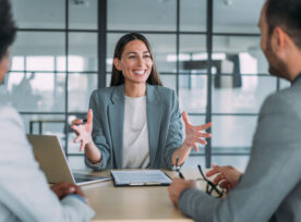 Group Of Business Persons Talking In The Office.