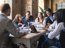 Group Of Multiethnic Businesspeople Discussing About Financial Strategy, Renewable Power, Sustainable Innovation Project And Environmental Economical Issues Business, Sustainability Interracial Lifestyle Concept