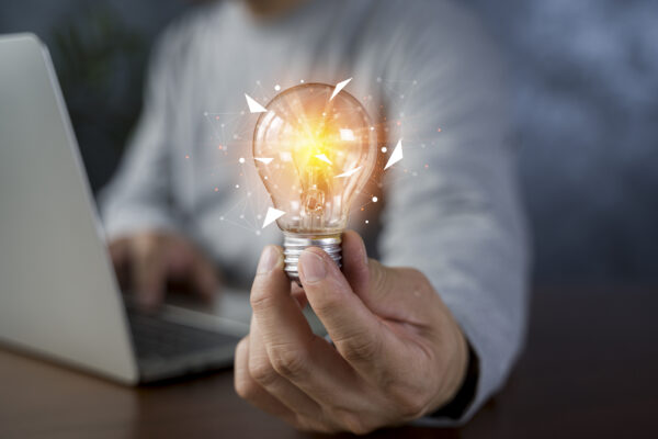 Innovation. Hands Holding Light Bulb For Concept New Idea Concept With Innovation And Inspiration, Innovative Technology