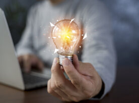 Innovation. Hands Holding Light Bulb For Concept New Idea Concept With Innovation And Inspiration, Innovative Technology