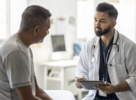 Male Doctor Talking With A Patient