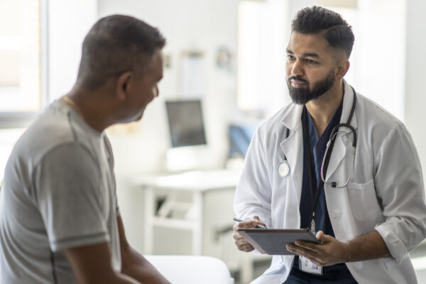Male Doctor Talking With A Patient