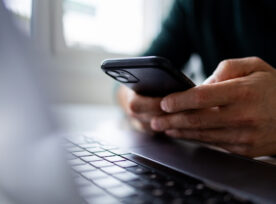 Close Up On Man Hand Using Mobile Phone