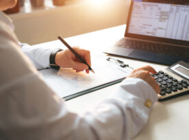 Businessman Calculating The Financial Statement Of His Business. Business Panoramic Banner With Copy Space. Accounting And Tax.