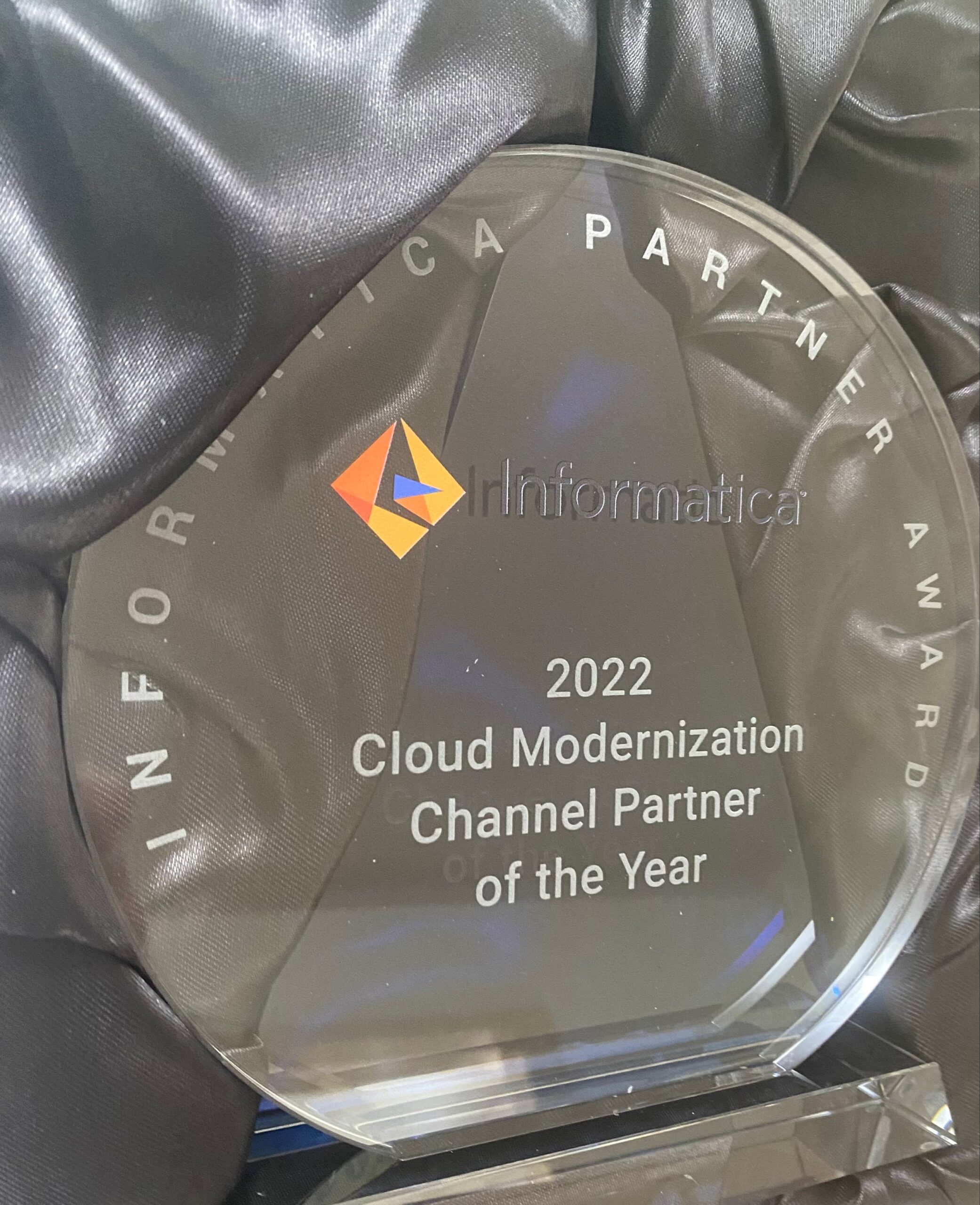 Trophy with inscription text Informatica 2022 Cloud Modernization Channel Partner of the Year