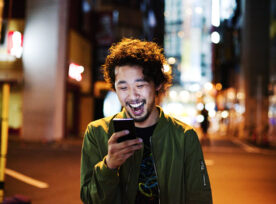 Photo of man in Japan using smart phone