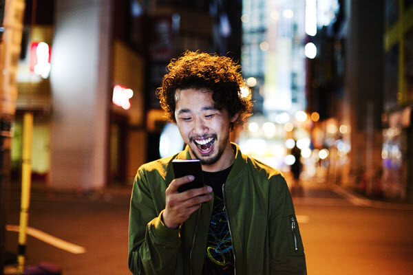 Photo of man in Japan using smart phone