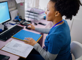 Nurse Working At The Reception Desk In The Private Clinic