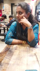 Sangeetha enjoying a pizza shop