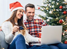 A couple doing online shopping during the holiday season