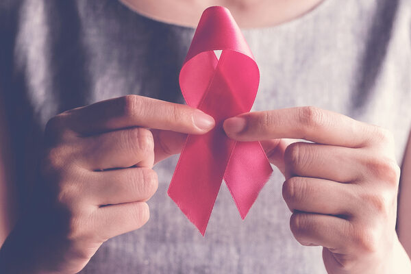 Woman Holding Pink Ribbon, Breast Cancer Awareness, October Pink Concept