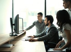 Group Of It Experts In Their Office.