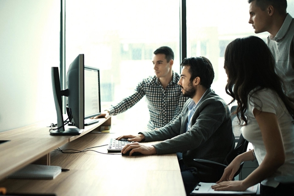 Group Of It Experts In Their Office.