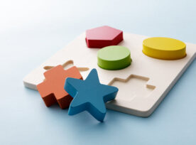 Explicit vs Implicit, illustrated by a children’s shape sorting toy.