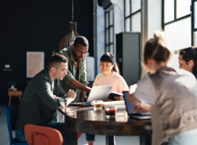 Diverse Team Working Together In Modern Co Working Space