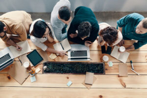 A team of tech workers troubleshooting together.