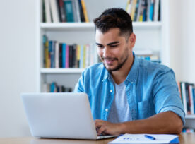 Handsome Mexican Hipster Man Sending Email With Laptop