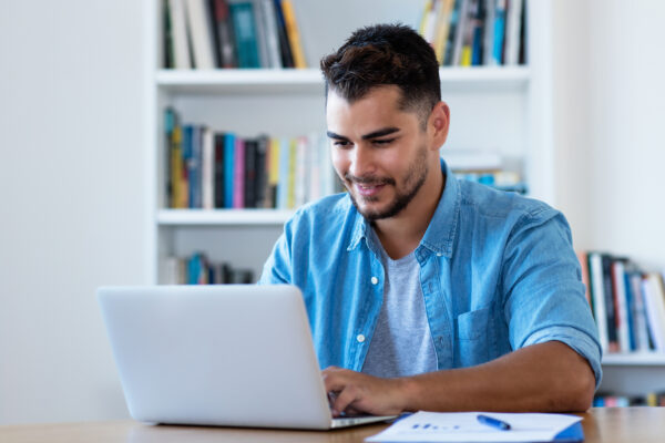 Handsome Mexican Hipster Man Sending Email With Laptop