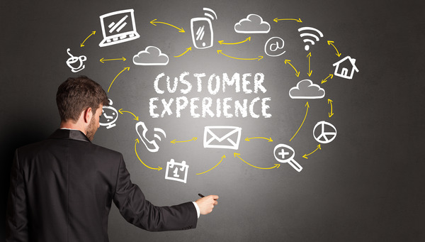 Istock 1214961329 Man At Board W 'customer Experience' And Icons (resized)