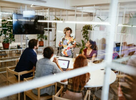 A group of coworkers meeting together.