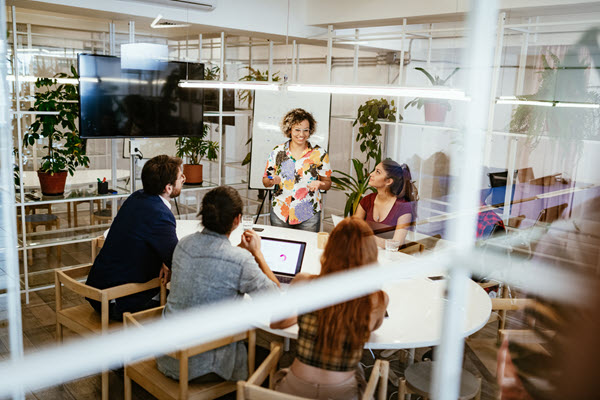 A group of coworkers meeting together.