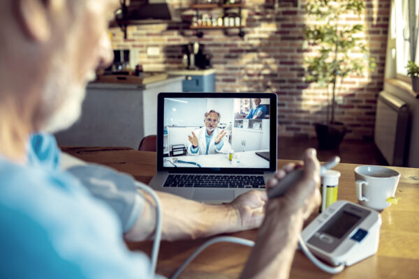 Senior Man Consulting With His Doctor Online