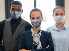Portrait Of Multi Racial Hotel Staff Wearing Protective Masks