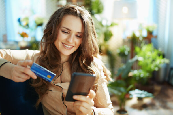 Woman In Sunny Day Making Online Shopping On E Commerce Website