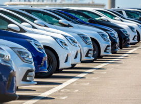 A row of a cars in a sales lot