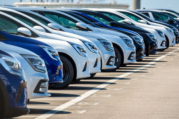 A row of a cars in a sales lot