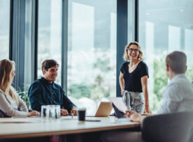 Business people having casual discussion during meeting stock photo