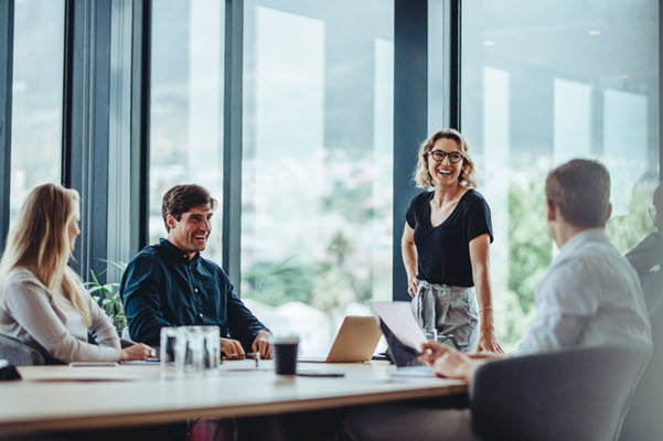 Business people having casual discussion during meeting stock photo