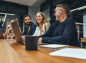 A team of tech workers in a meeting together.