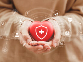 Women Hands Holding Red Hearts With Virtual Medical Network Connection Icons, Health Care, Life Insurance Business Concept, And Rising Growth In Hospital And Health Insurance Business. World Health Day