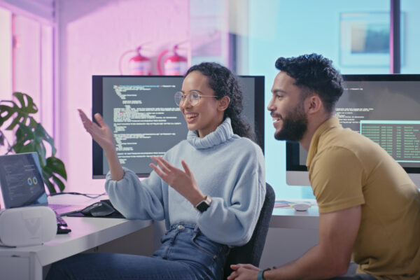 Collaboration, Coding And Programming With An Engineer Man And Woman At Work Together As A Team In A Data Center. Teamwork, Cyber Security And Information With A Male And Female Working On A Database