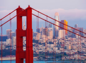 Golden Gate Bridge Tower With San Francisco Cityscape In The Background In California